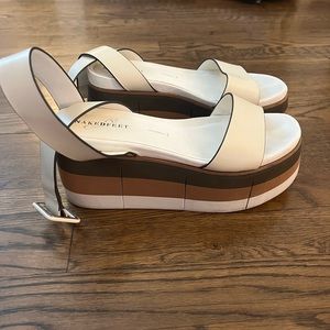 Naked feet white and brown sandals